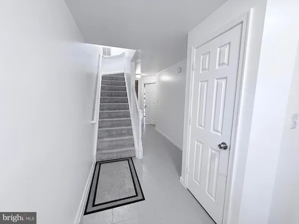 a view of a hallway view with staircase