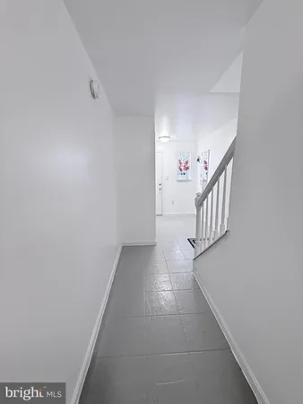 a bedroom with a bed and a desk