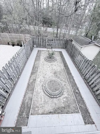 a view of backyard with deck and wooden floor