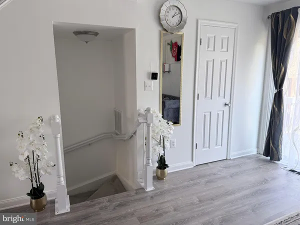 a view of entryway with wooden floor