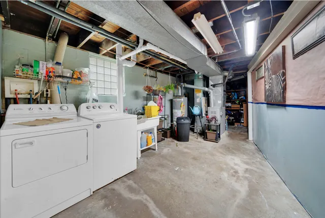 a view of storage and utility room with washer and dryer