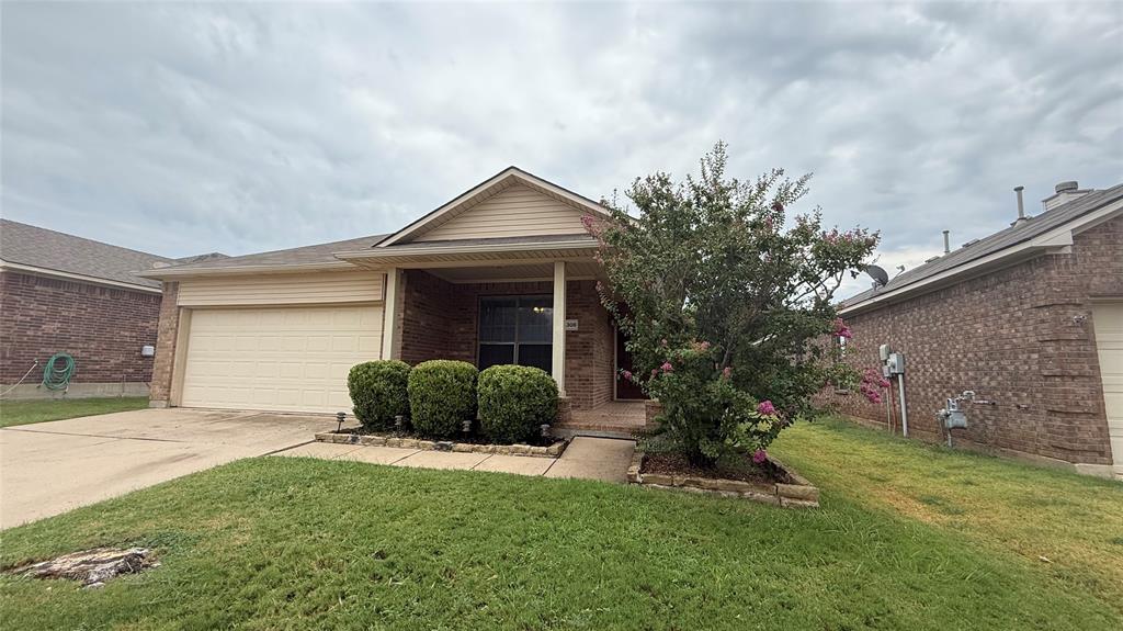 14308 Polo Ranch Street Fort Worth, TX 76052 - Photo 3 of 19 Single-story brick and siding residence featuring an attached garage