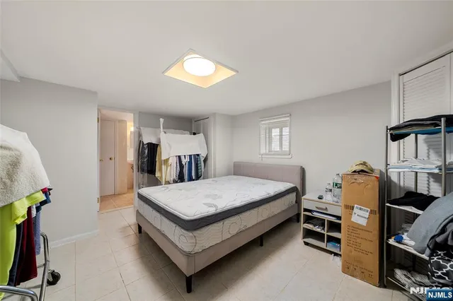 a bed room with a bed and a window