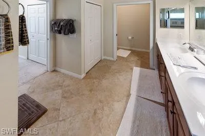 a view of a walk in closet and bedroom
