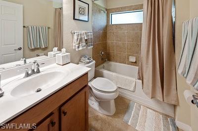 9844 Venezia Circle, Unit 721 Naples, FL 34113 - Photo 17 of 50 a bathroom with a sink a toilet and shower