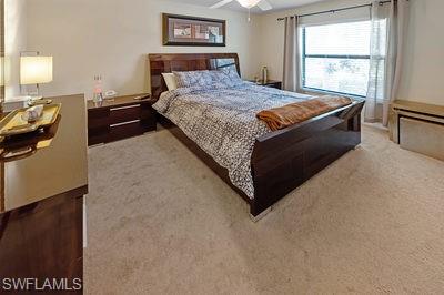 9844 Venezia Circle, Unit 721 Naples, FL 34113 - Photo 18 of 50 a bedroom with a bed and window
