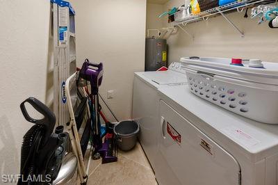 9844 Venezia Circle, Unit 721 Naples, FL 34113 - Photo 20 of 50 a utility room with dryer washer and other items