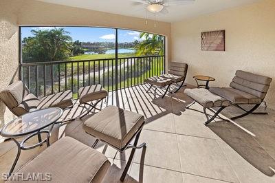 9844 Venezia Circle, Unit 721 Naples, FL 34113 - Photo 21 of 50 a view of a chairs and table in patio