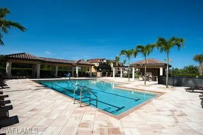 a view of a swimming pool with a patio