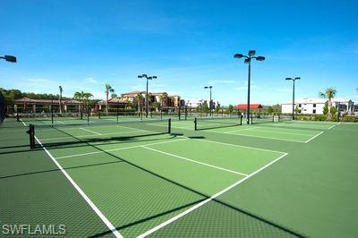 9844 Venezia Circle, Unit 721 Naples, FL 34113 - Photo 27 of 50 a view of a tennis court