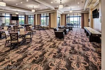 a large room with lots of chairs and mirrors