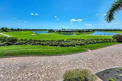 a view of a golf course with a big yard