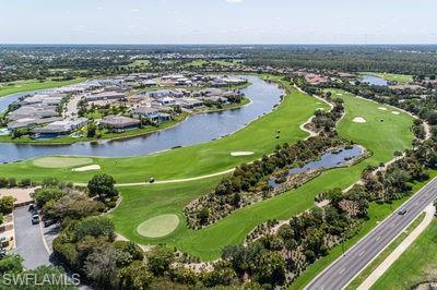 9844 Venezia Circle, Unit 721 Naples, FL 34113 - Photo 37 of 50 an aerial view of residential houses with outdoor space and lake view in back
