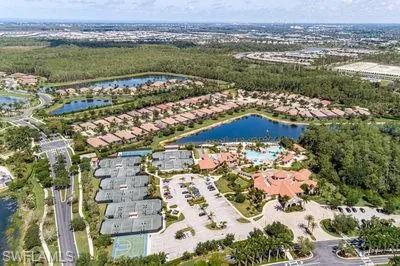 a view of a swimming pool with a vase of flowers