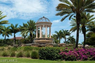 9844 Venezia Circle, Unit 721 Naples, FL 34113 - Photo 50 of 50 a front view of a house with a yard