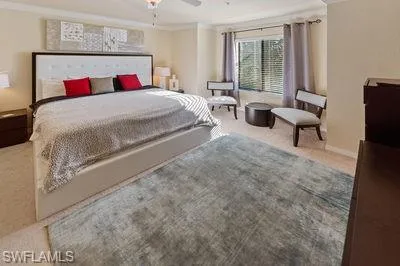 a living room with a bed furniture and a large window