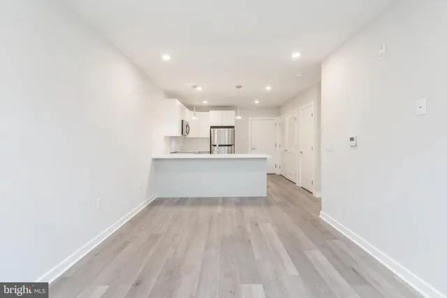 a view of kitchen with wooden floor