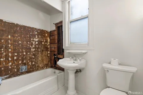 a bathroom with a sink toilet and bathtub