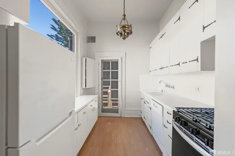 a bathroom with a double vanity sink and a bathtub