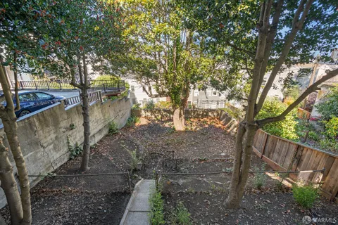 a view of a backyard of the house