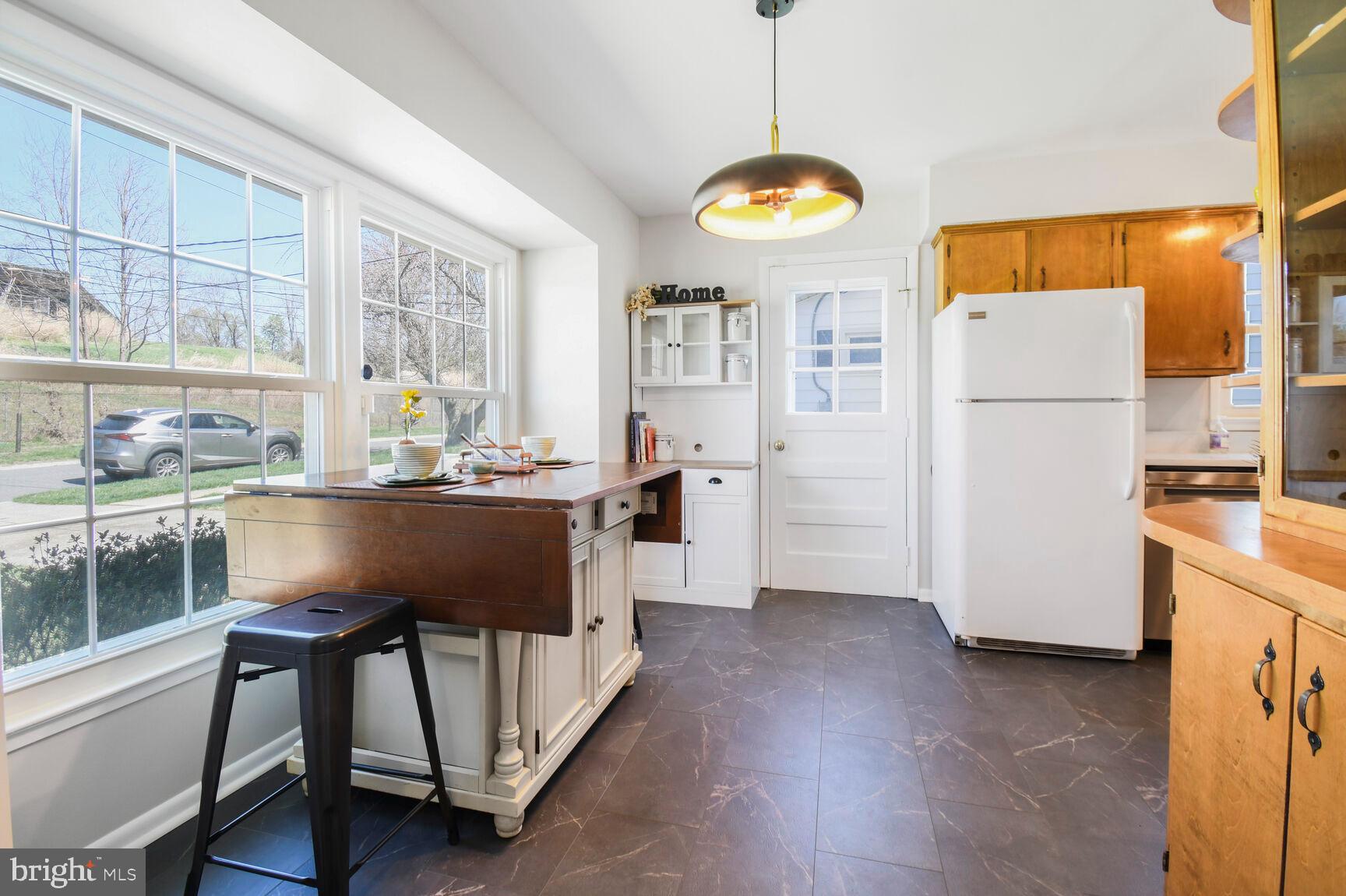 Eat-in kitchen, handy side door beyond