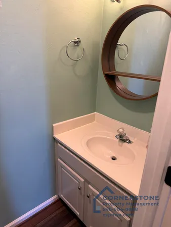 a bathroom with a sink and mirror
