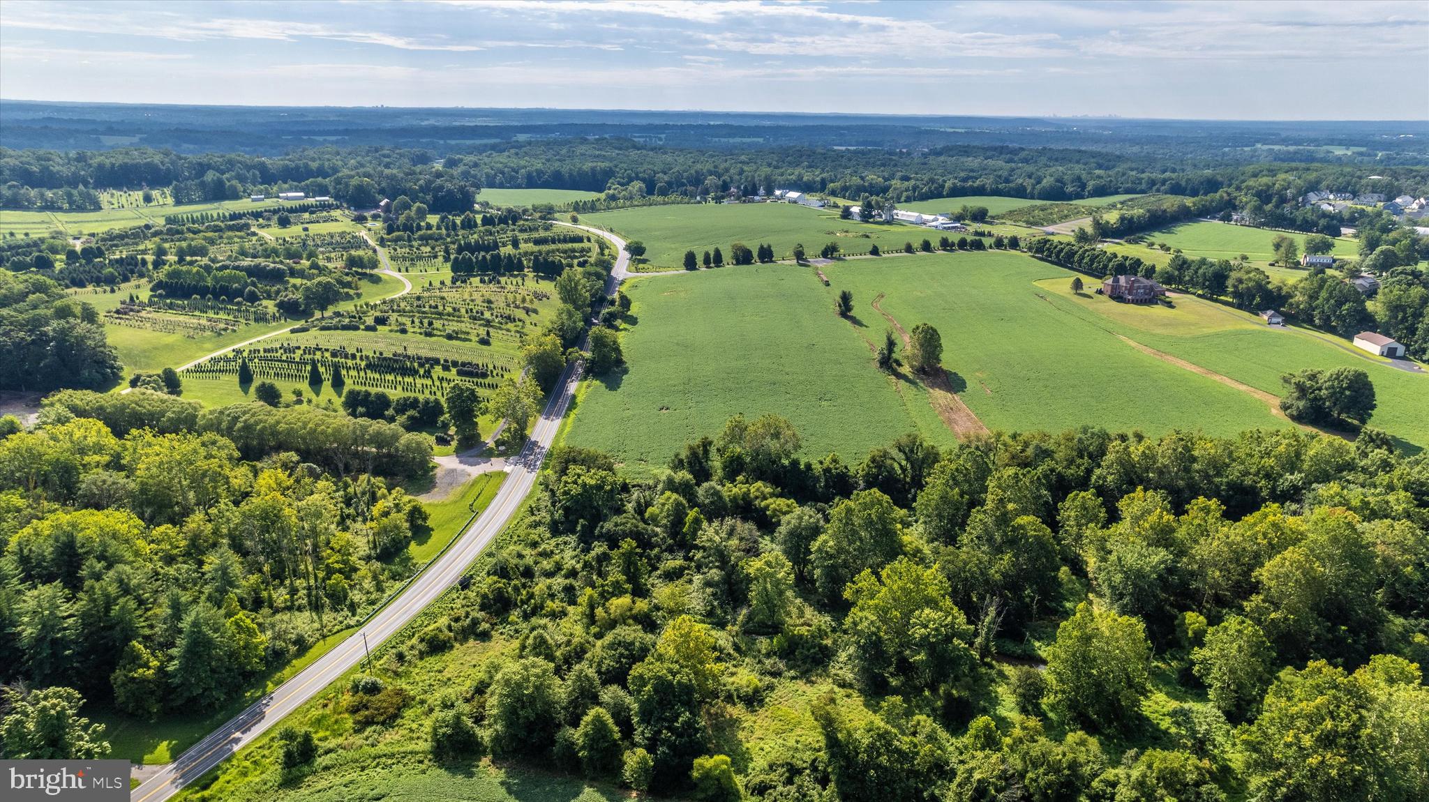 19101 Darnestown Road Poolesville, MD 20837 - Photo 13 of 27 an aerial view of a houses with a yard and lake view