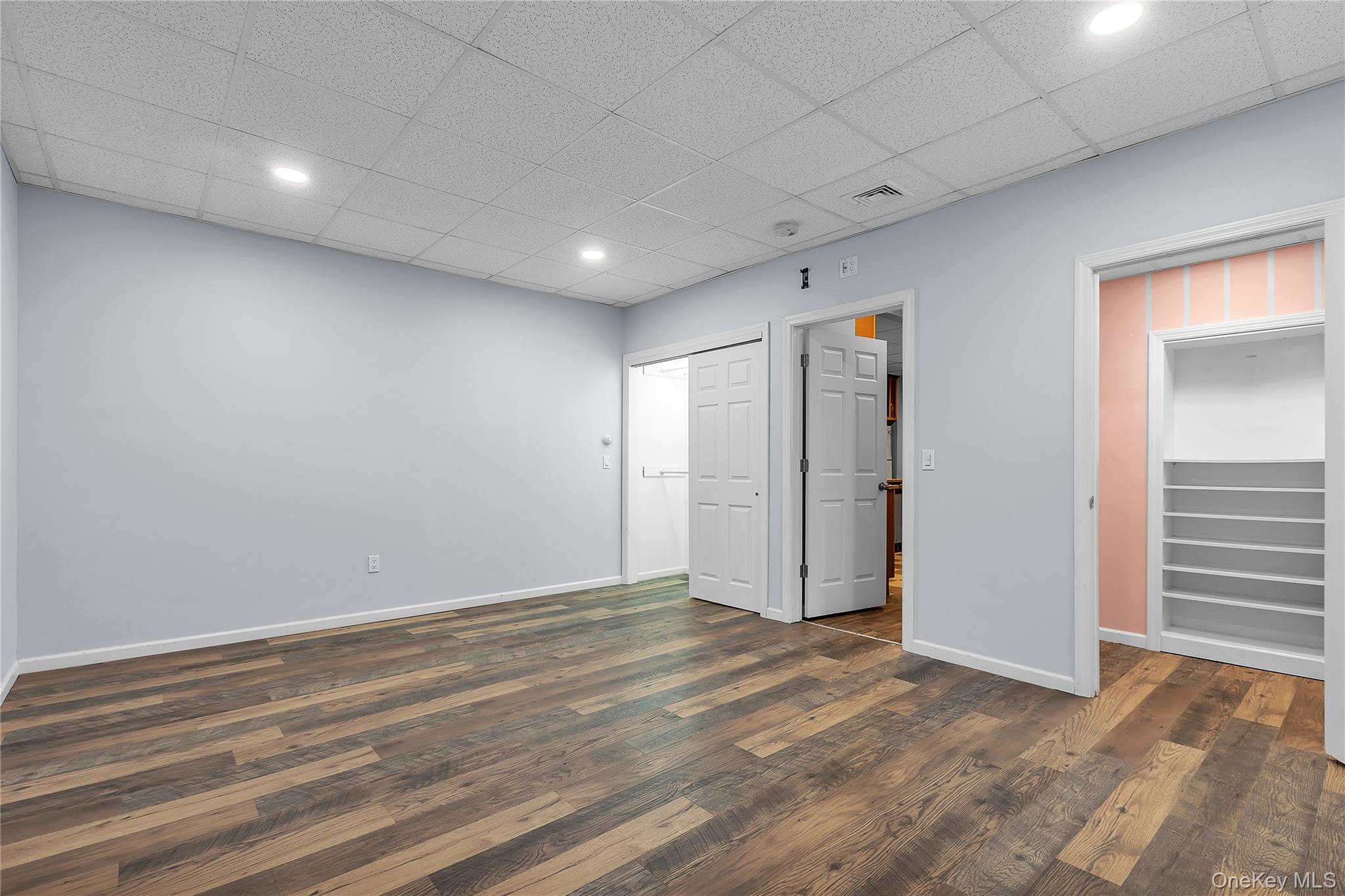 22 Lauro Ridge Court, Unit LOWER LEVEL Mahopac, NY 10541 - Photo 18 of 29 Bedroom features a walk-in closet along with a second closet.