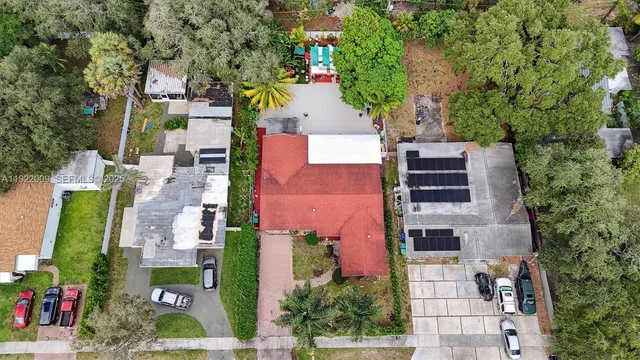 an aerial view of residential houses with outdoor space