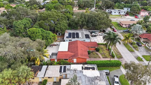 an aerial view of residential houses with outdoor space