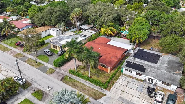 an aerial view of residential house with outdoor space and street view
