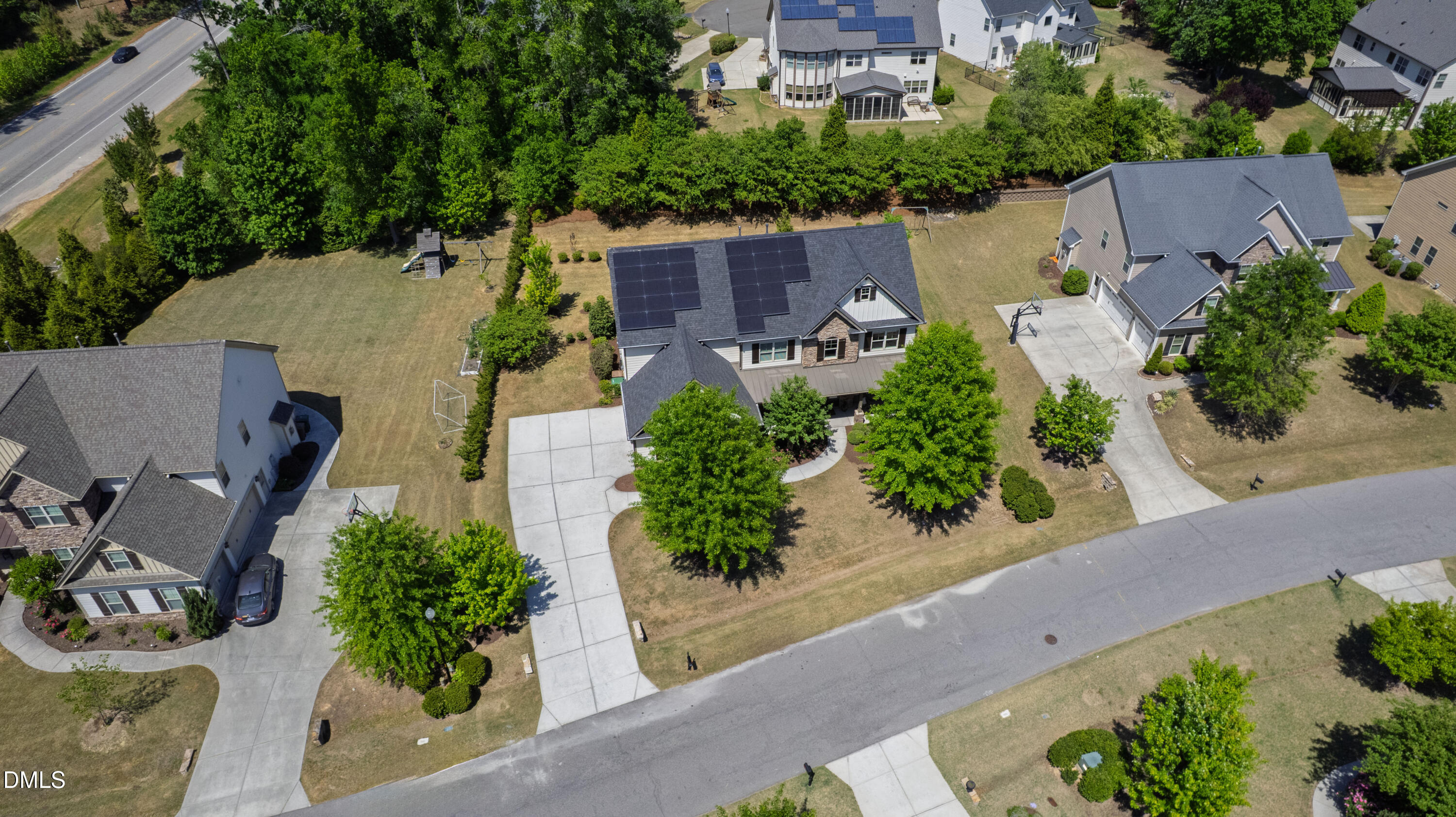 313 Karpen Lane Cary, NC 27519 - Photo 71 of 86 an aerial view of a house with a garden and lots of trees