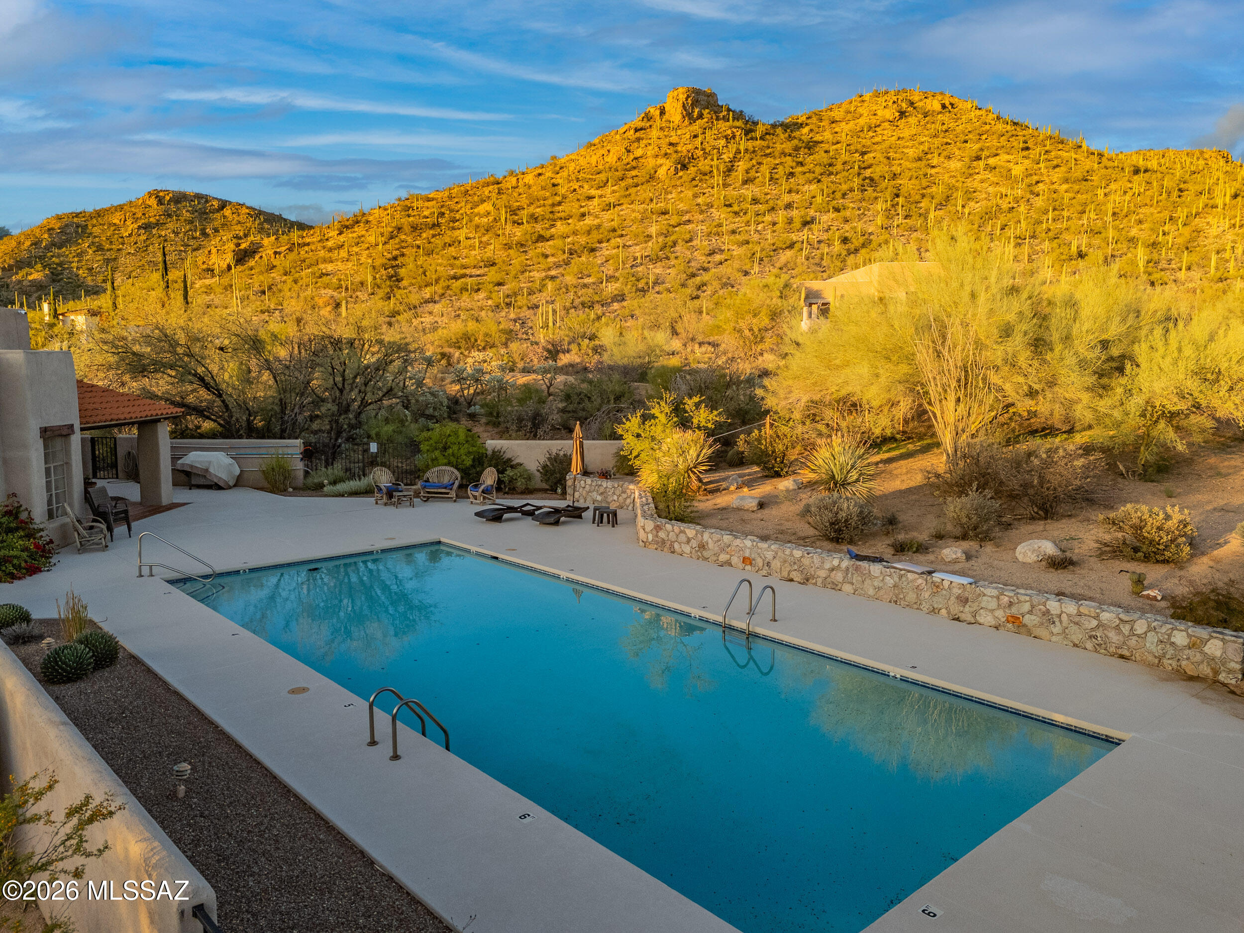 13630 East Sahuaro Sunset Road Tucson, AZ 85749 - Photo 44 of 47 a view of a swimming pool and an outdoor space