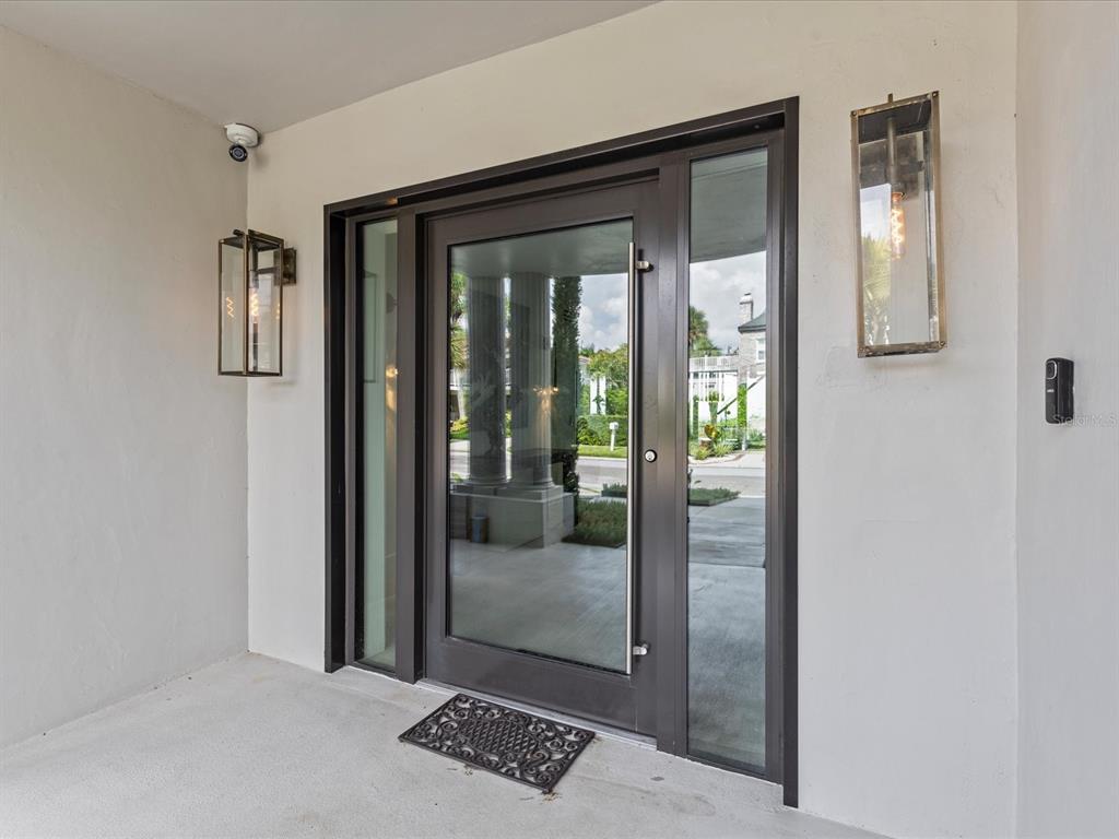 780 Eldorado Avenue Clearwater, FL 33767 - Photo 14 of 98 a view of a hallway with wooden floor and windows