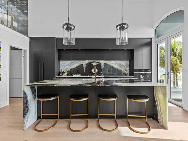 a spacious bedroom with a large bed and a window