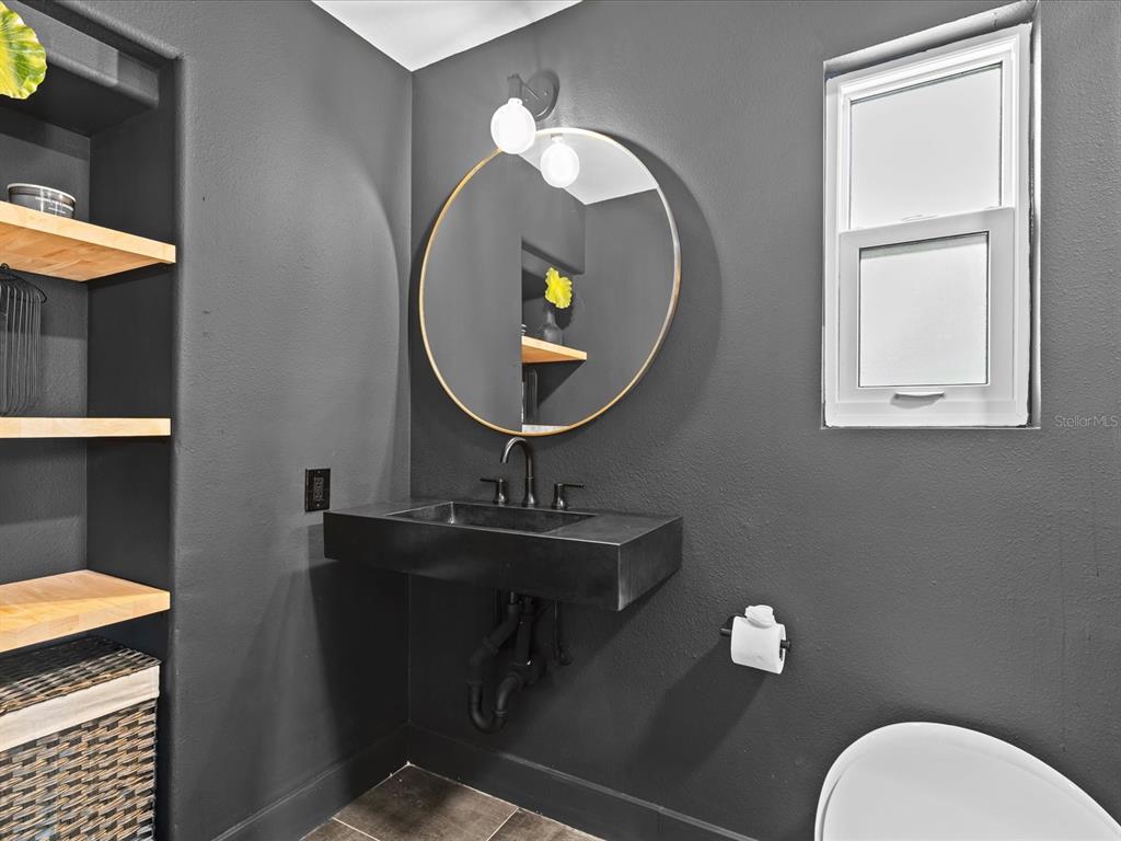 780 Eldorado Avenue Clearwater, FL 33767 - Photo 57 of 98 a bathroom with a toilet mirror and sink