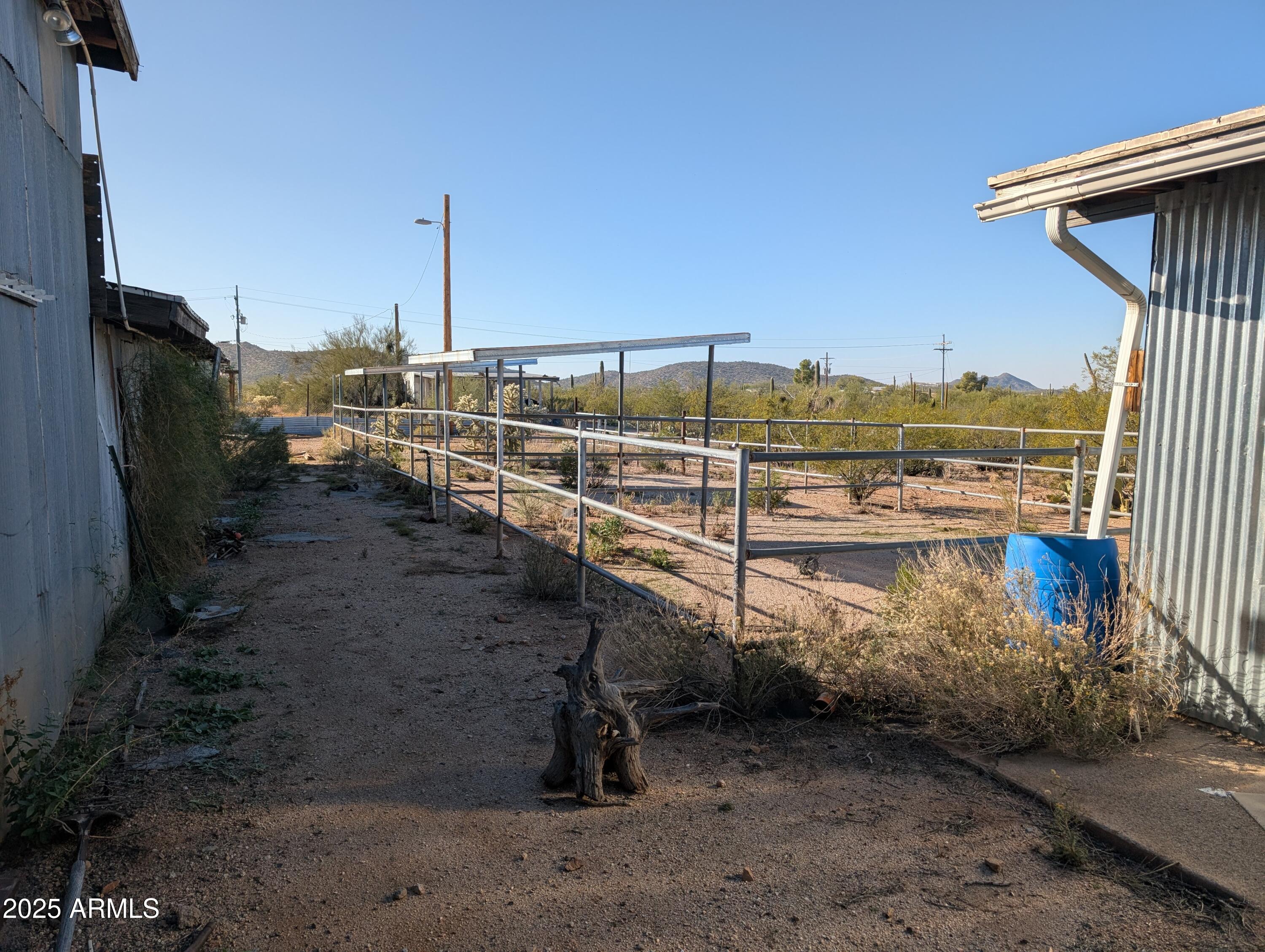 44000 East Fairmont Drive Tucson, AZ 85739 - Photo 14 of 49 a view of a terrace with wooden fence