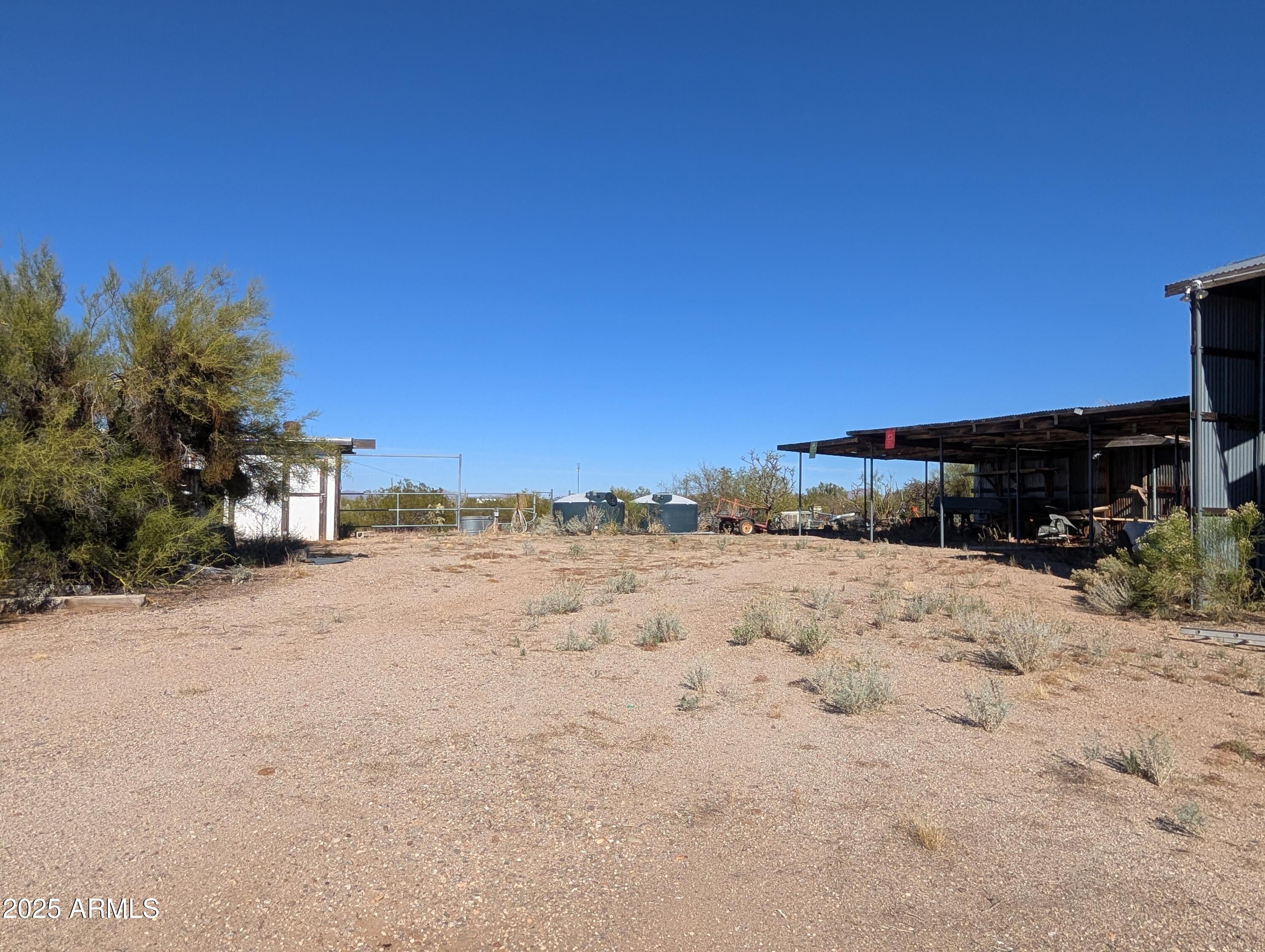 44000 East Fairmont Drive Tucson, AZ 85739 - Photo 19 of 49 a view of a dry yard with a house