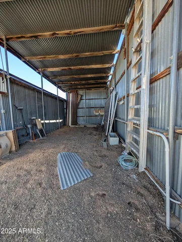 a view of a storage room with racks on the wall