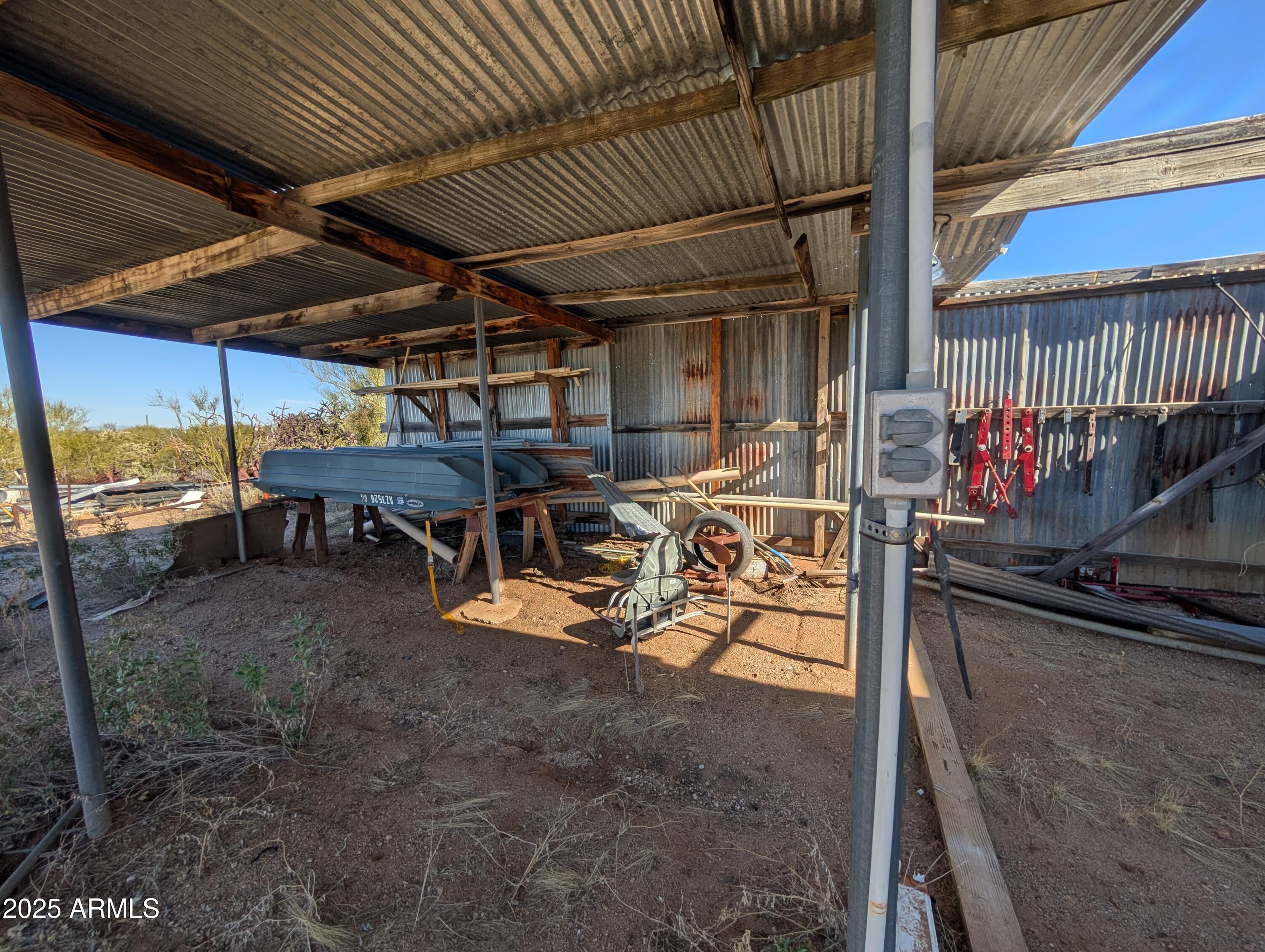 44000 East Fairmont Drive Tucson, AZ 85739 - Photo 22 of 49 a view of a storage room with racks on the wall