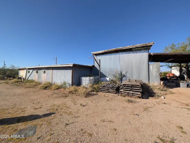 a view of a house with a snow in the background