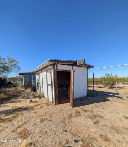 a view of a yard with cars