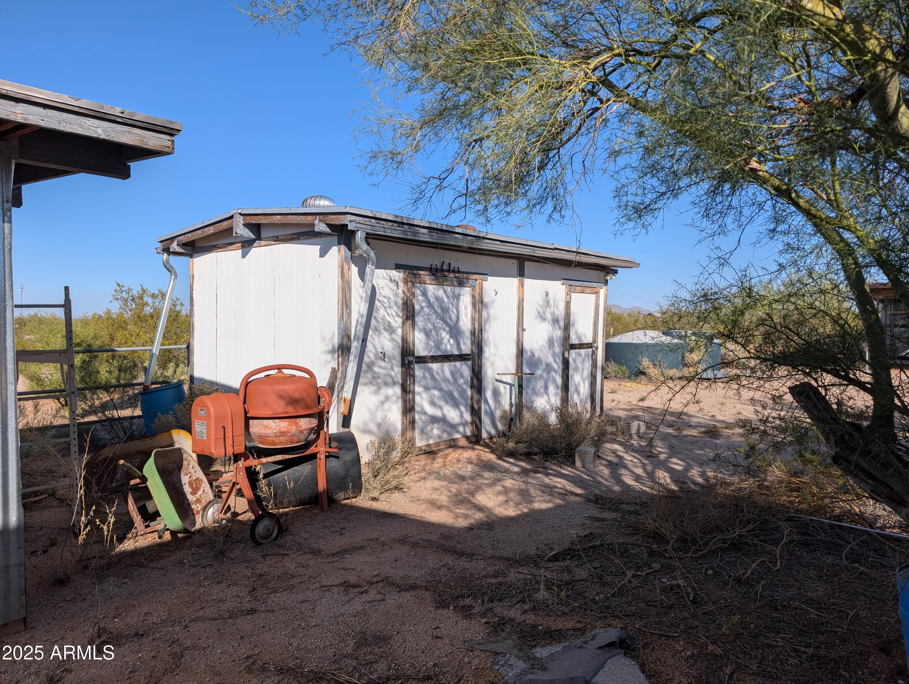 44000 East Fairmont Drive Tucson, AZ 85739 - Photo 30 of 49 a view of backyard with barbeque grill and wooden fence