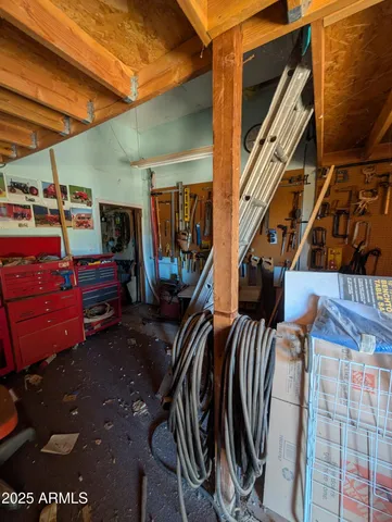 a view of a patio with table and chairs and potted plants