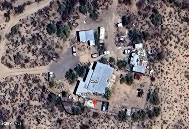 a view of a car park in front of a house