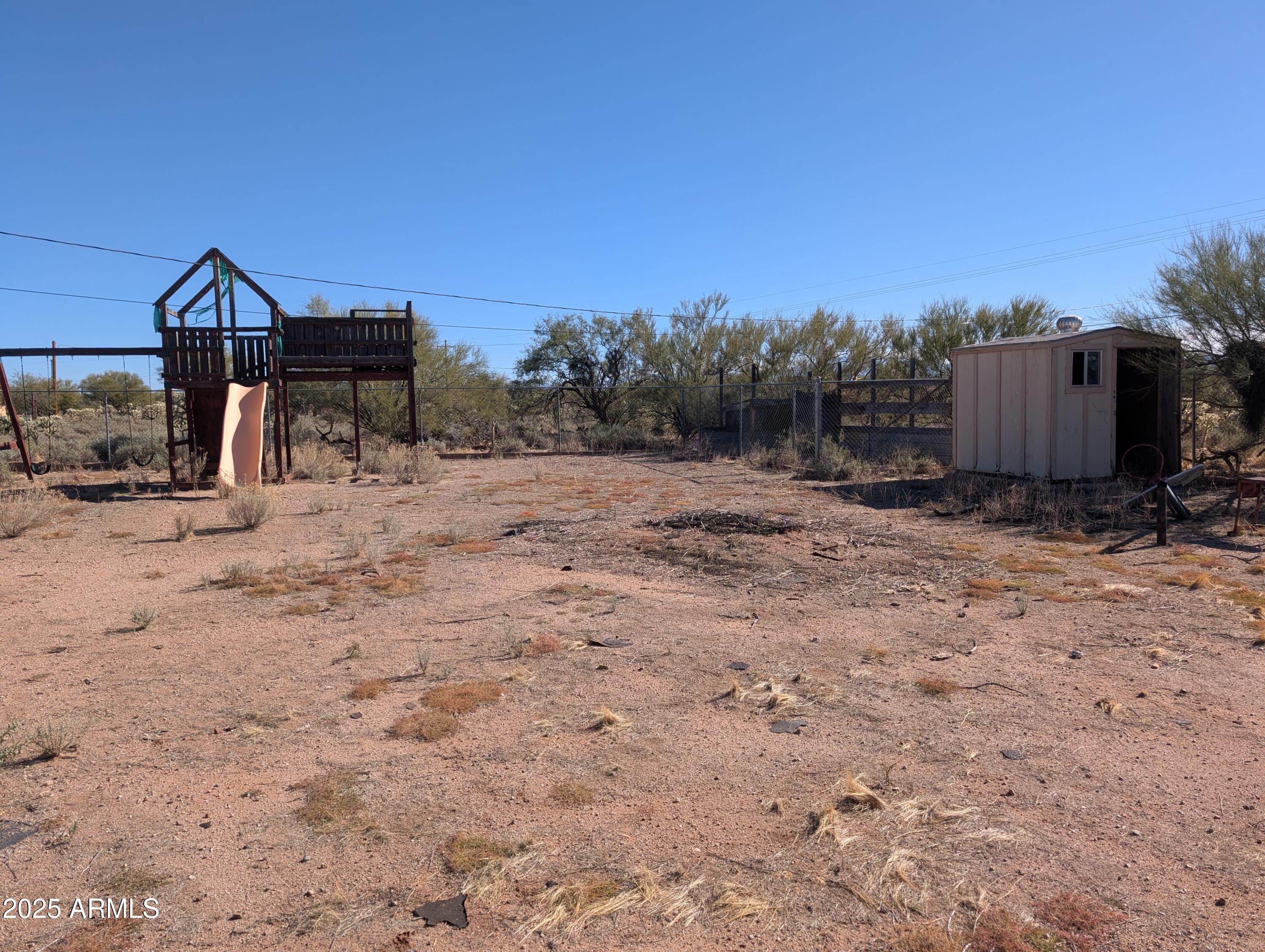 44000 East Fairmont Drive Tucson, AZ 85739 - Photo 45 of 49 a view of a dry yard with wooden fence