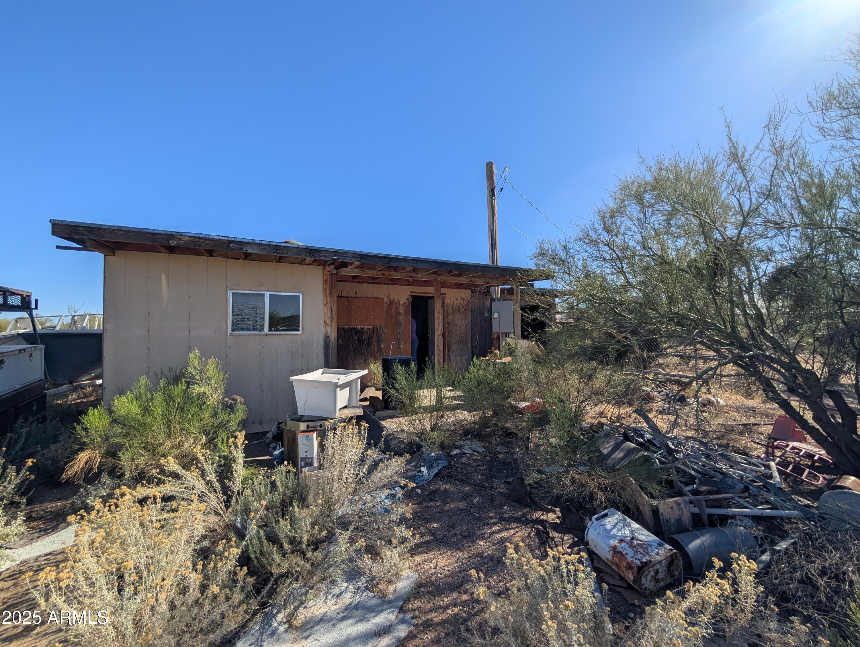 44000 East Fairmont Drive Tucson, AZ 85739 - Photo 46 of 49 a view of a patio with table and chairs and potted plants