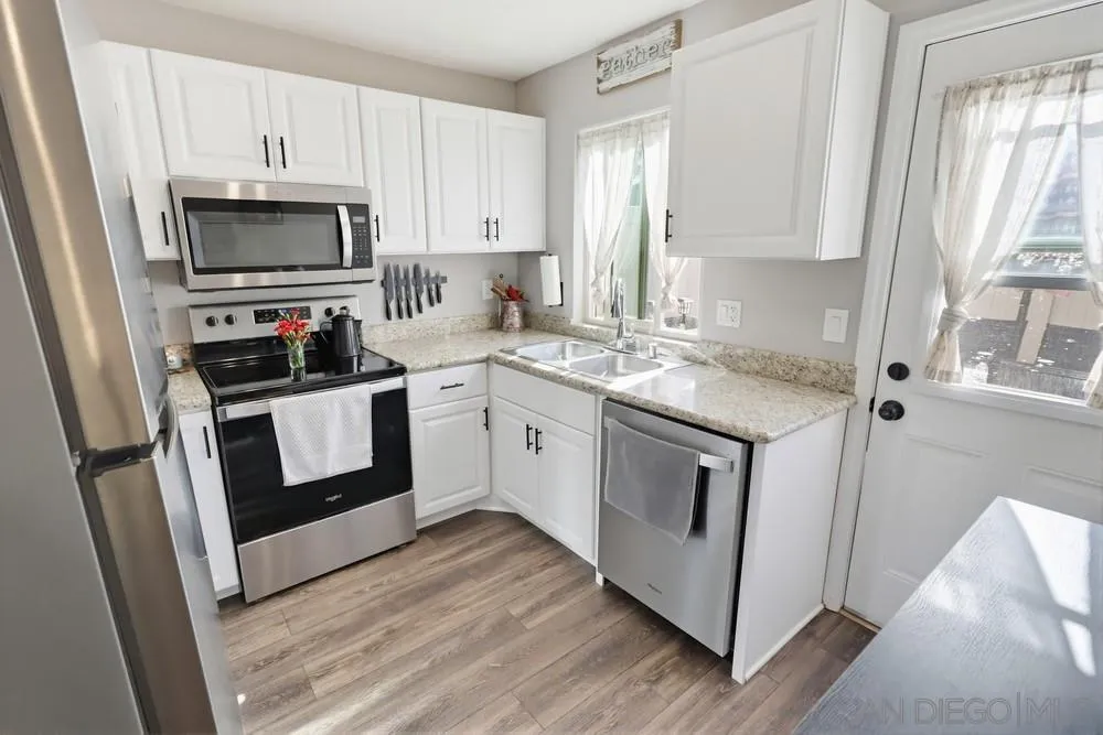 2616 Alpine Boulevard, Unit 28 Alpine, CA 91901 - Photo 10 of 34 a kitchen with white cabinets and white appliances