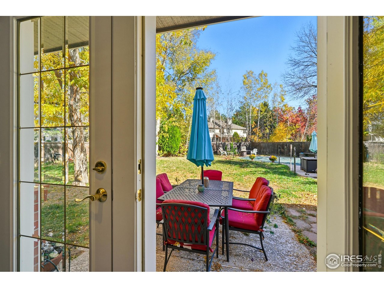 4584 Robinson Place Boulder, CO 80301 - Photo 4 of 34 French doors leading to a beautiful, fenced in backyard with a pool.