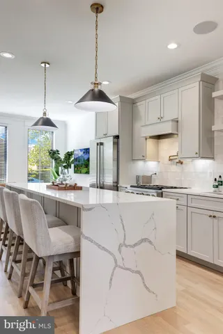 a kitchen with stainless steel appliances granite countertop a stove and a sink
